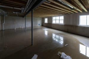 Flooded basement with standing water after water damage.